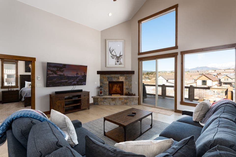 Beautiful living area with, high ceilings, gas fireplace, smart tv, and views of the Continental Divide.