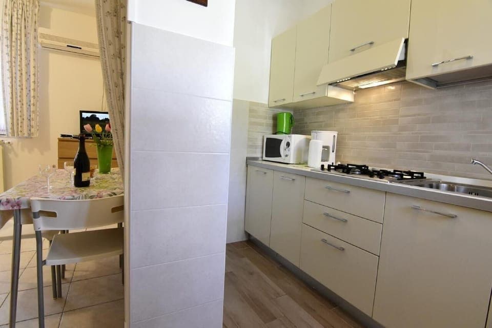 The kitchen and access to the living room