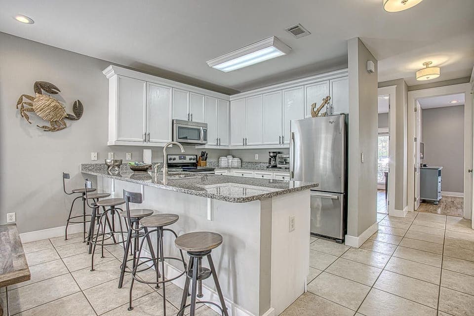 6 counter seating and view to back bedroom space