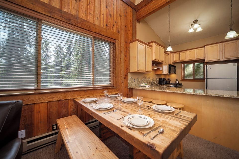 Gather around your rustic wooden dining table for memorable meals, with a fully equipped kitchen ready for your culinary adventures.