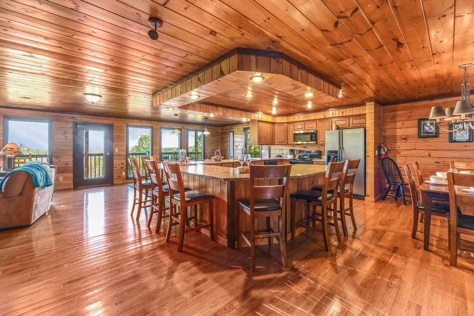 【Kitchen + Dining】8 raised chairs surround the fully stocked kitchen for all your entertaining needs!