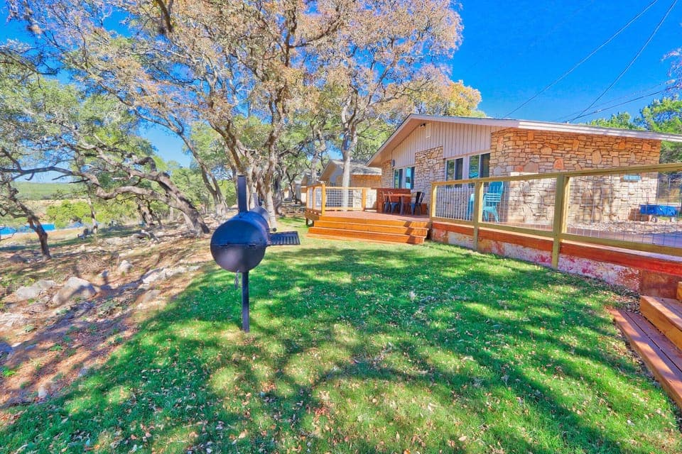 Charcoal grill just off the deck area.