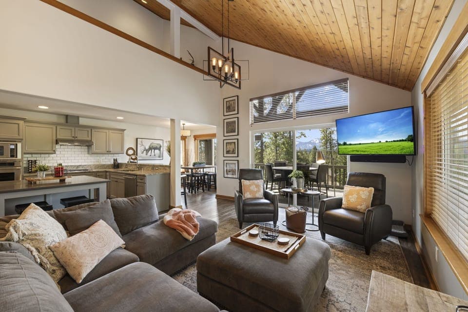 Living Room With Floor-To-Ceiling Windows, Vaulted Wood Ceiling And Deck Access