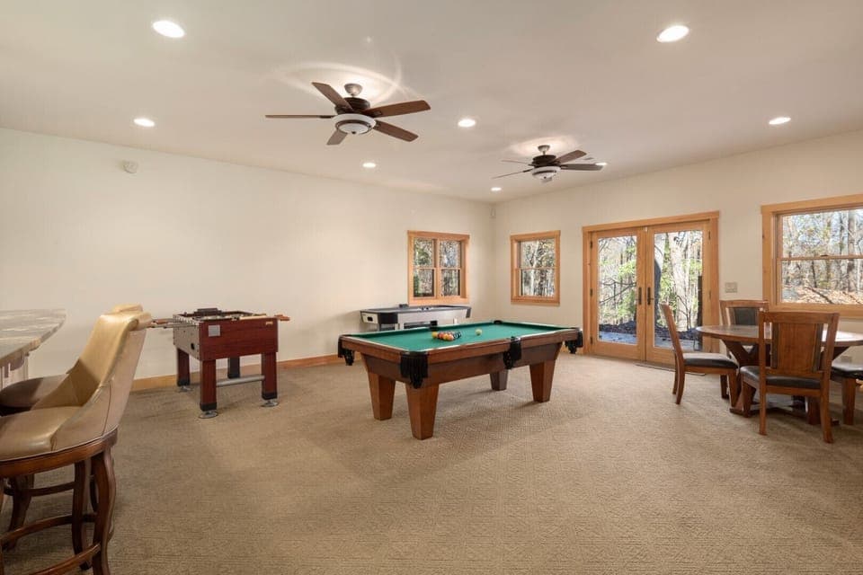 Everyone can play games at the same time.  Glass doors lead to the lower level patio.