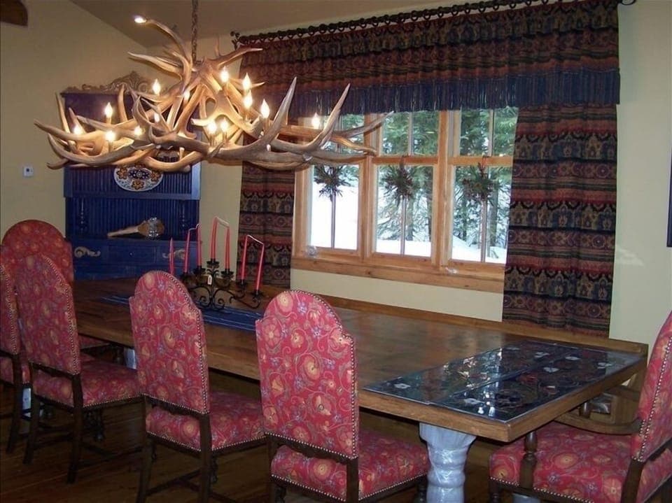 Huge handmade farmers table with seating for 20, antler chandelier