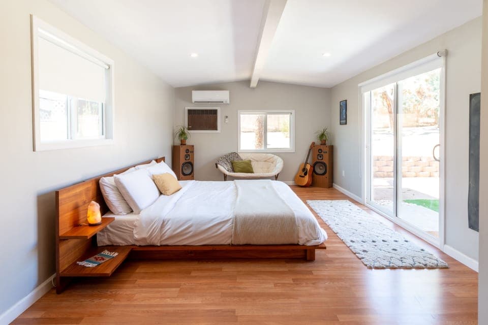 This bedroom gets beautiful natural light! With darkening shades to sleep.
