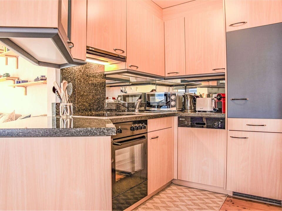 Cabinetry, Countertop, Property, Kitchen Appliance, Kitchen Stove, Kitchen, Building, Wood, Interior Design, Architecture