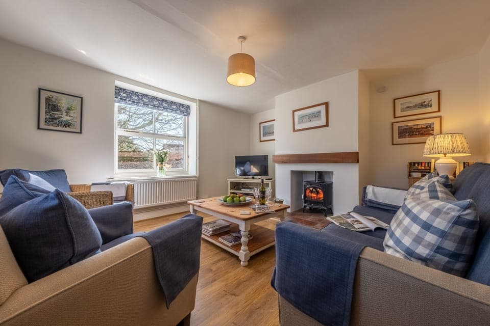 Pink End, North Creake: The cosy sitting room has a wood burning stove