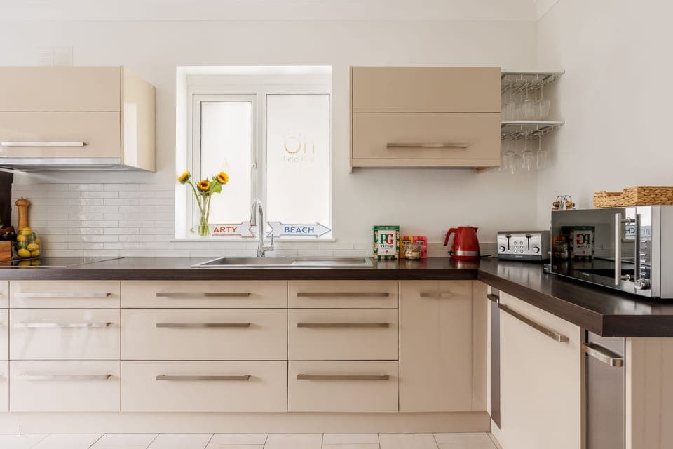 The kitchen is fully equipped with all the necessary appliances and tools.