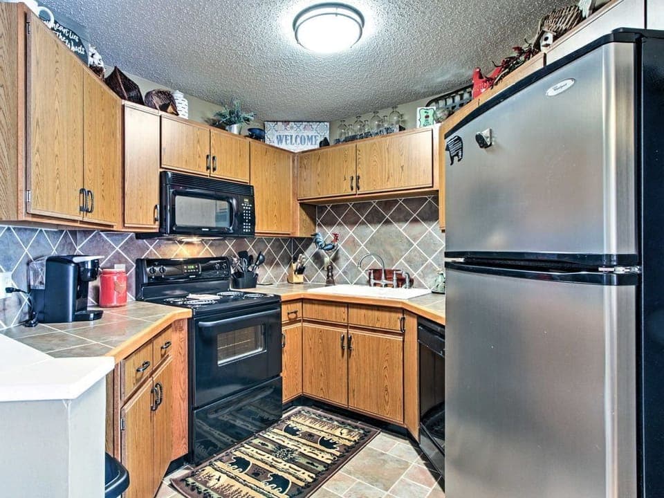 Fully stocked kitchen — new glass-top stove, dual coffee makers, full cookware