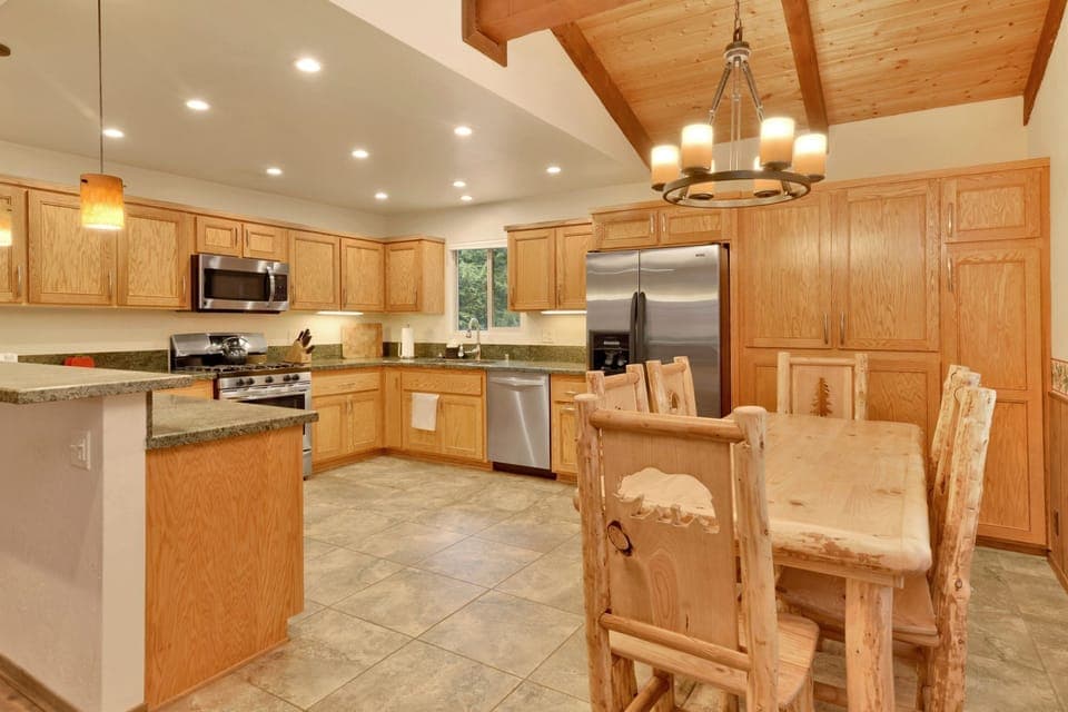 Spacious kitchen with modern appliances and ample counter space, perfect for the gourmet cook to create and entertain