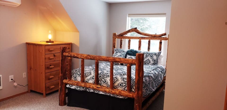 Queen bed in Upper Log Bedroom