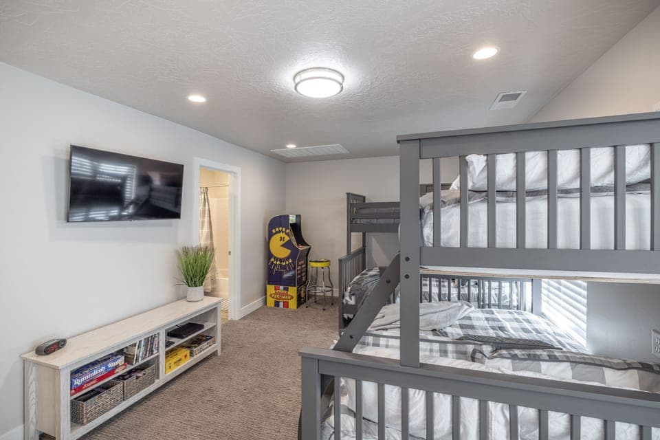 Bedroom 4 Loft View - Bedroom 4 is an unenclosed loft has an arcade game, private TV, and board games.