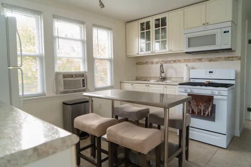 Kitchen with many  items to cook, bake and serve with...