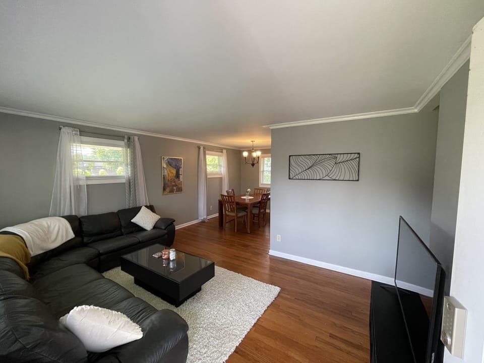 Spacious living room with leather sectional couch