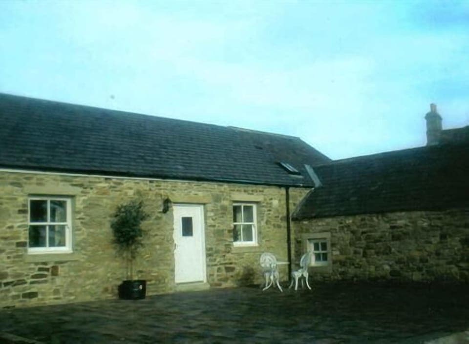 Front view of Bull Pen, with patio and lawned area.