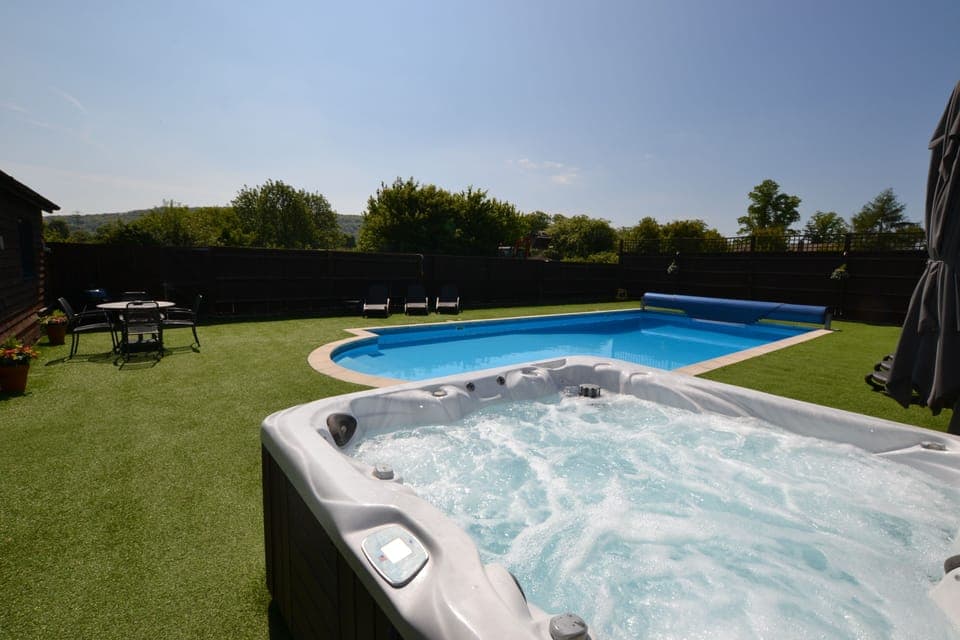 Private seasonally heated pool and year round hot tub (Exclusive to The Pool House)