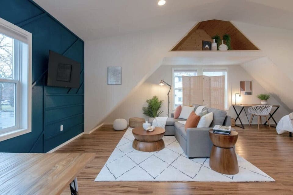 Relax in style—cozy seating with curated art and design accents.