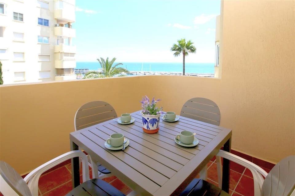 Lovely private terrace with sea views and dining area for four guests