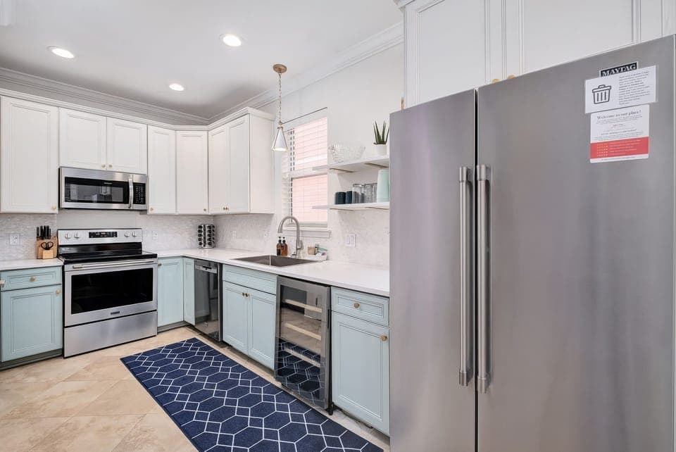 Kitchen with a full size fridge plus a beverage fridge for extra space