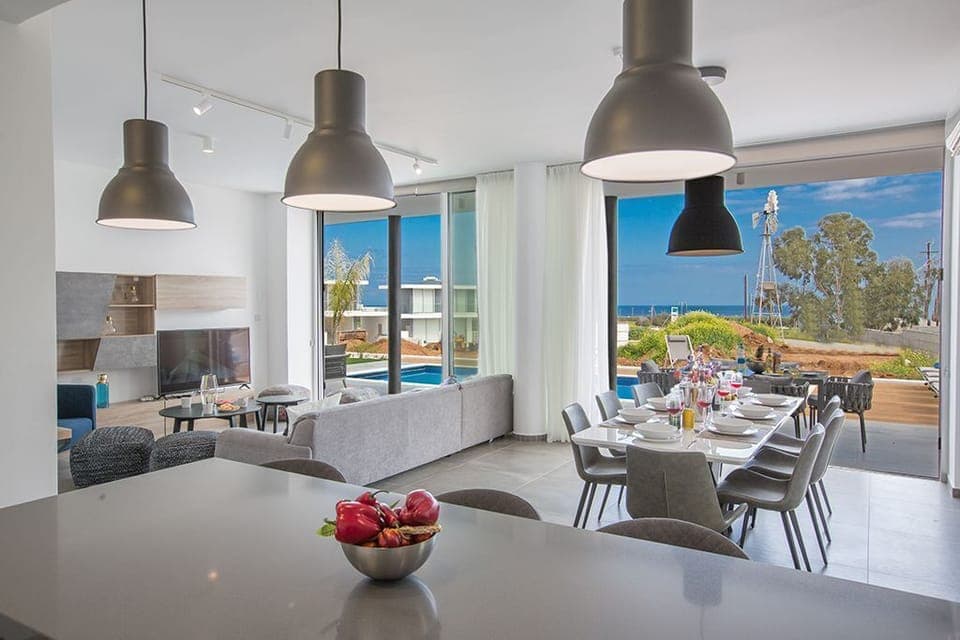 Living room and dining area with seaviews