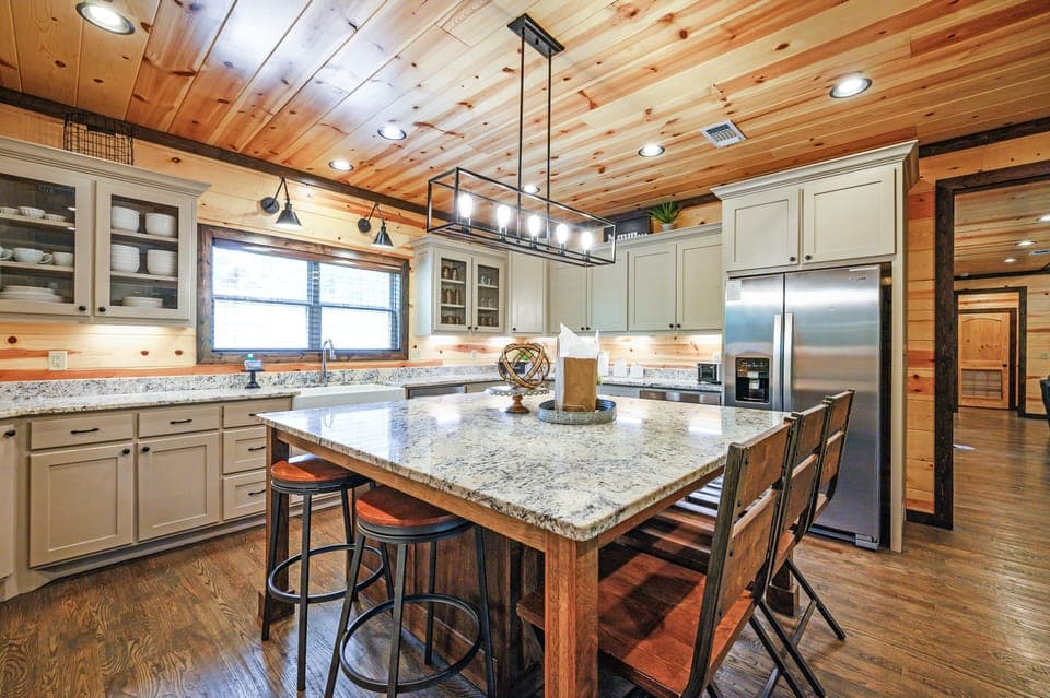 The kitchen comes with an oversized island that seats an additional 7.