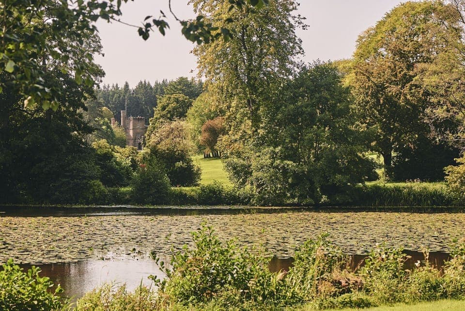 The lake surrounded by the estate gardens at The Byre, Welsh Borders