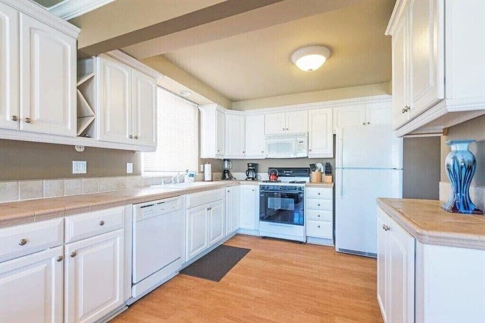 Upper unit kitchen. Dishwasher, microwave, blender, crockpot,12 cup coffee maker and cook/dinnerware