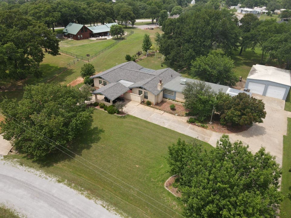 Aerial view of the property and surrounding area