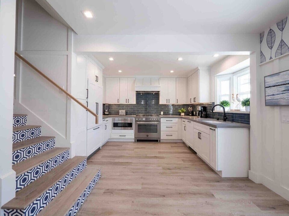Modern kitchen with Bertazzoni oven and Fisher Paykel refrigerator and dishwasher. Coffee Maker. Blender, Toaster provided.