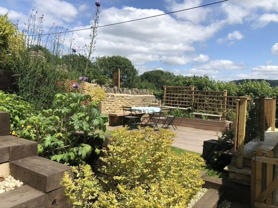 Decked area outside with a coal BBQ