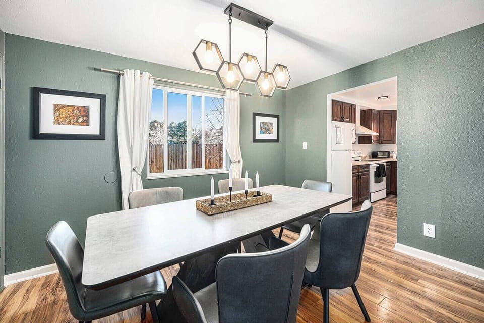 - Gather around this stunning dining table for cozy breakfasts or lively dinners
- Eye catching hexagon lighting sets the mood for unforgettable mealtime moments
- Bask in natural sunlight with backyard views just steps from the kitchen

