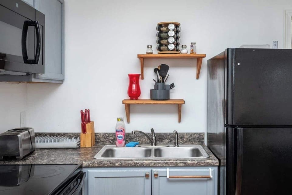 Full size kitchen with refrigerator, stove/oven and microwave