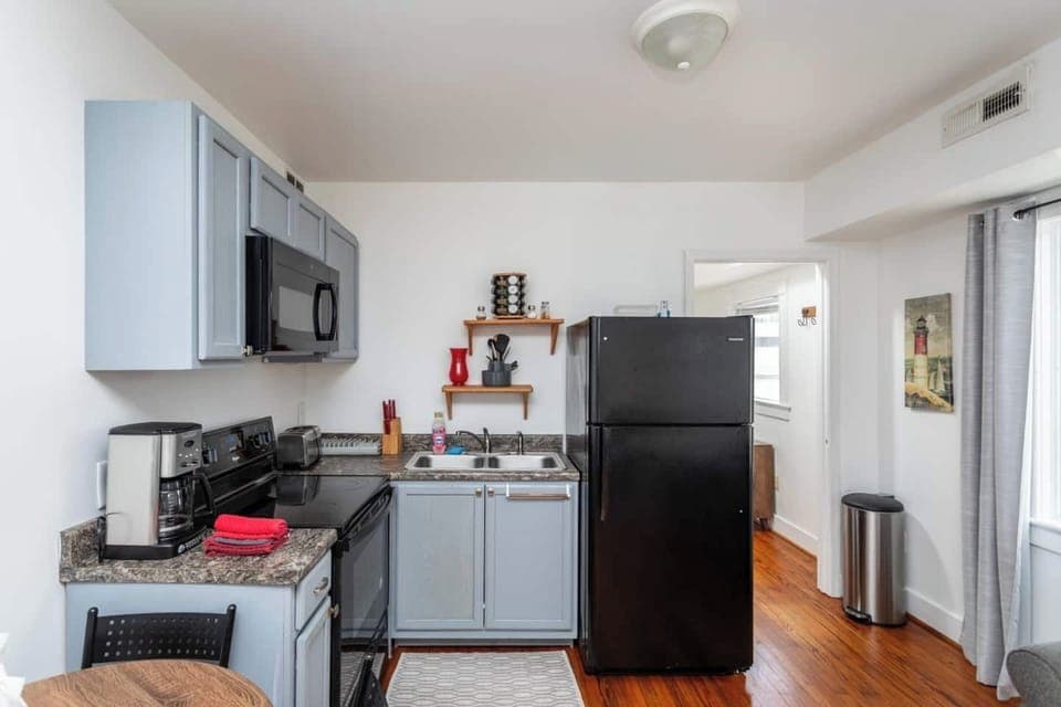 Full size kitchen with refrigerator, stove/oven and microwave