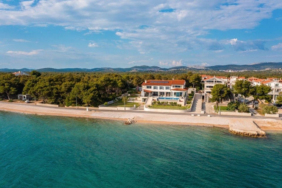 Aerial view of a luxury villa Sea Whisper with private pool, sauna, jacuzzi and gym by the sea in Sibenik