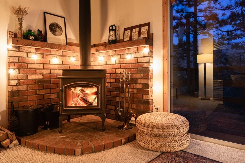 Cozy up by the warm wood burning fireplace at Scout's Hideaway! - Cozy up by the warm wood burning fireplace at Scout's Hideaway!