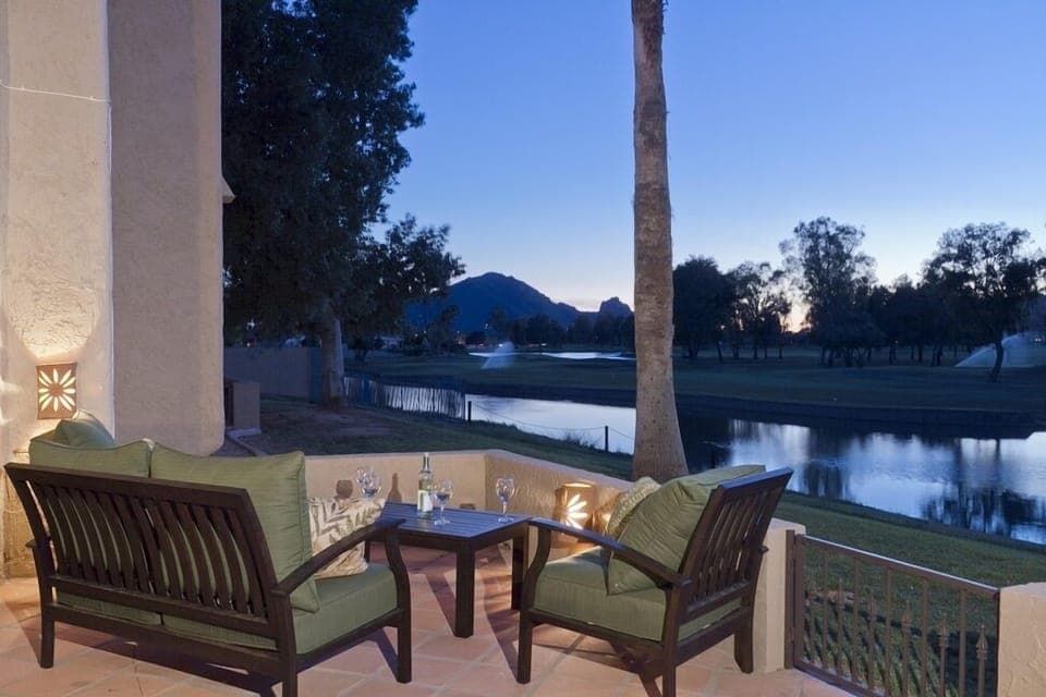 Expansive private patio overlooking the golf course and waterway. It is half covered for shade lovers and half open for sun worshippers.