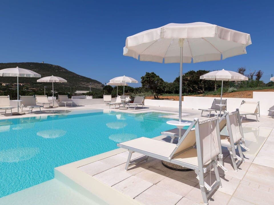 Water, Sky, Furniture, Azure, Building, Umbrella, Swimming Pool, Sunlounger, Outdoor Furniture, Shade