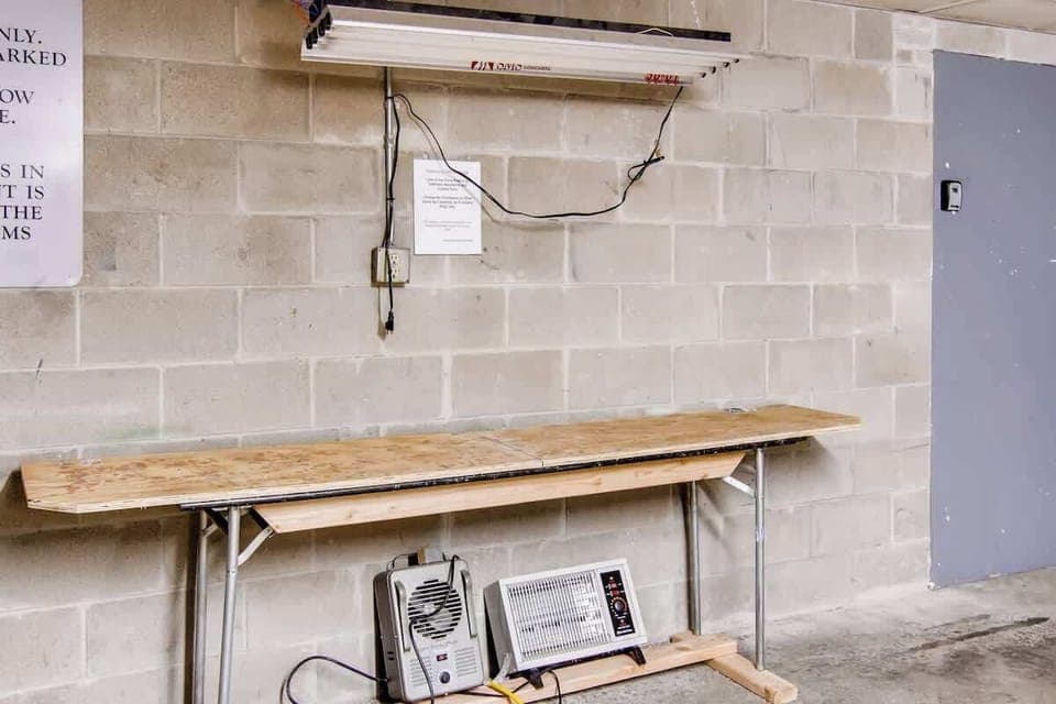 Public use ski wax station setup in the garage