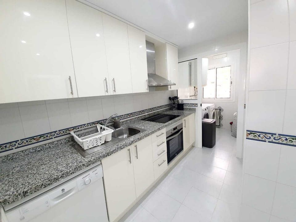 Fully equipped kitchen with oven and induction hob. Washer & Dryer provided