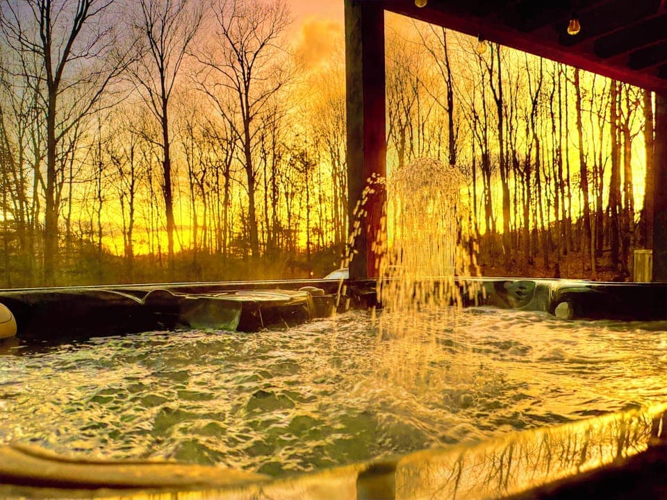 Sunrise in winter often brings bright colors, soak it in from a hot tub