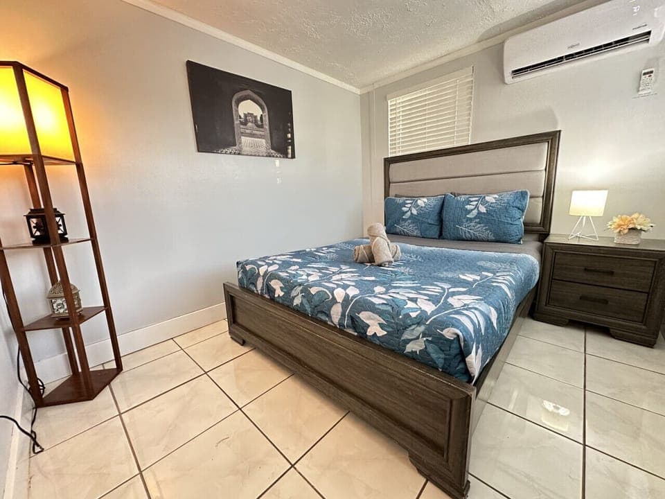 Well decorated bedroom with queen bed