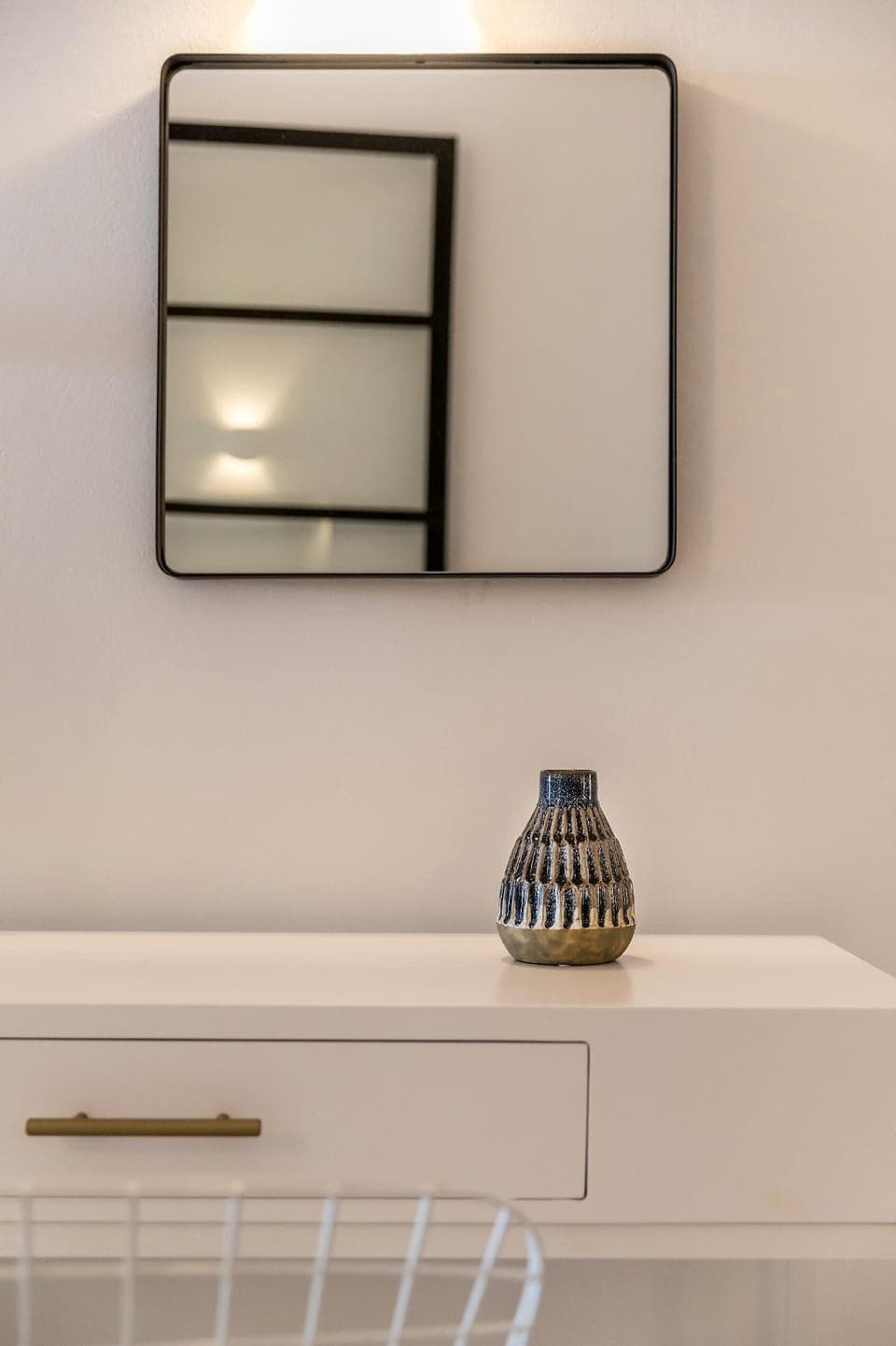 Mirror above the desk