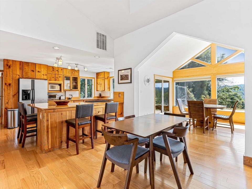 Open kitchen & dining. Sky lights, vaulted ceiling, windows & views!