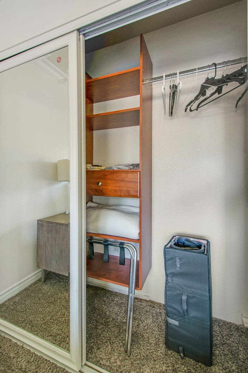 large closet with shelves at bedroom 2