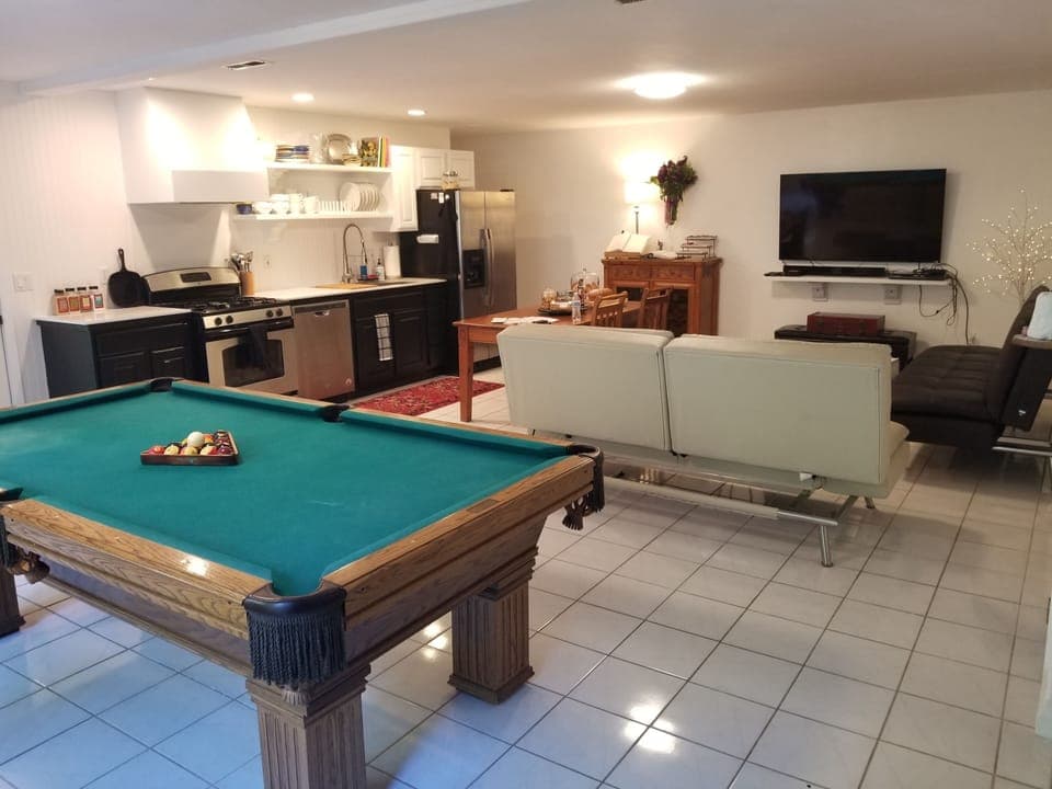 Great Room view to forest- pergola. Kitchen.  coffee tea bar. cable TV.