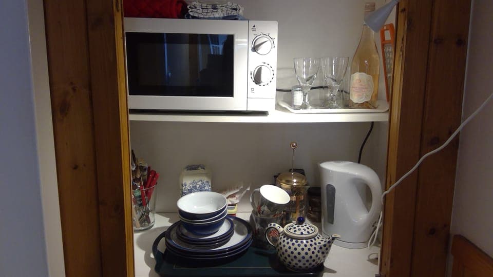 Micro kitchen with utensils. 