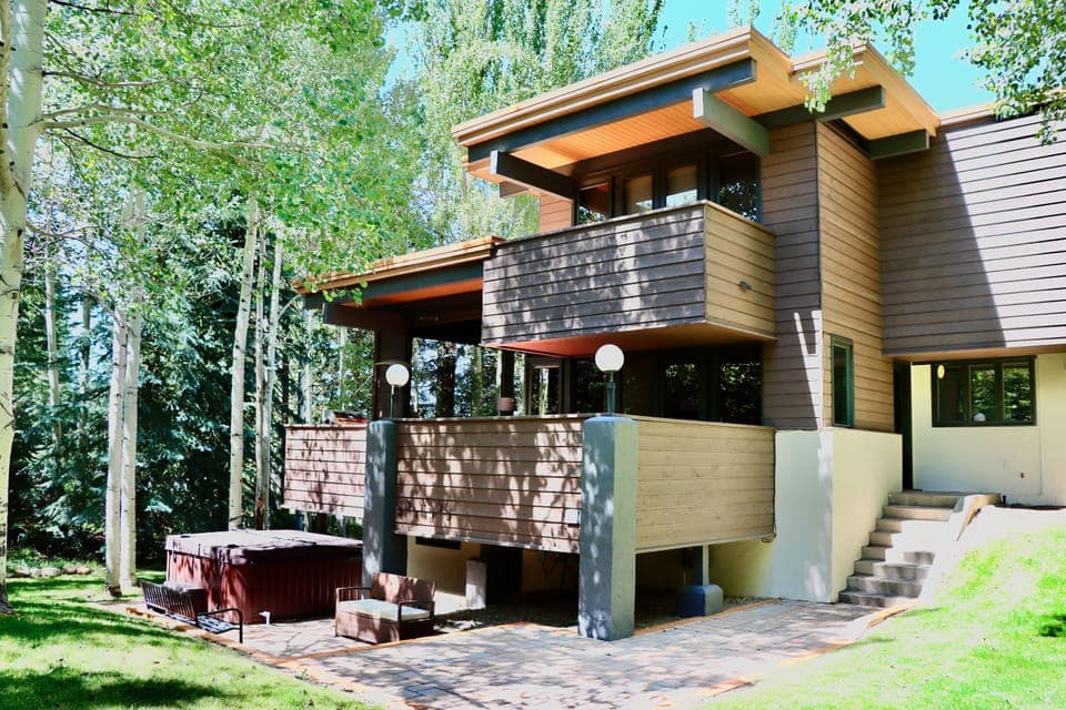 Side of home with lower terrace, 6 person Jacuzzi and large privateyard
