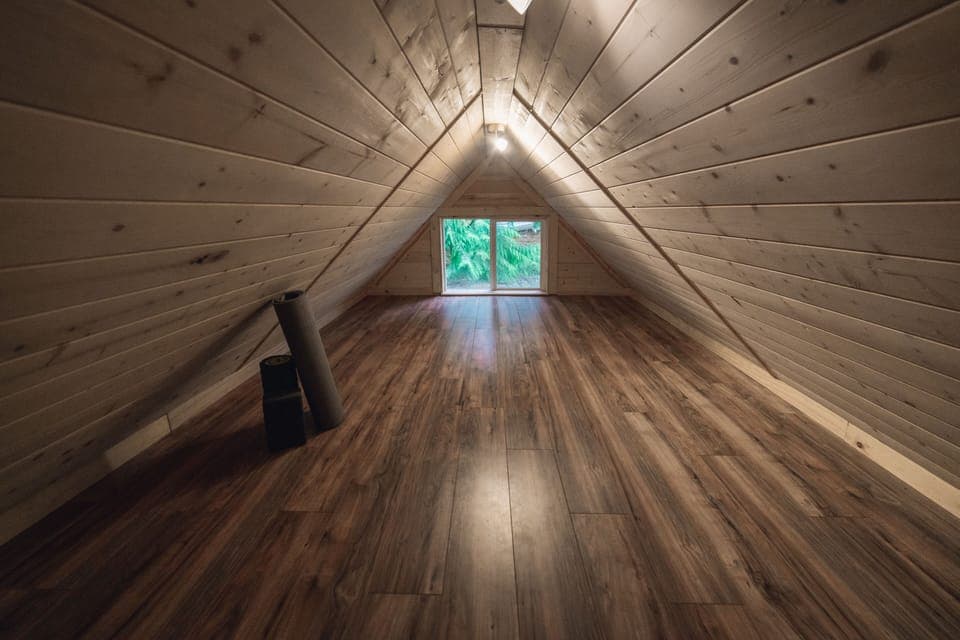 Climb the ladder in the studio to unwind in the non-standing yoga studio loft