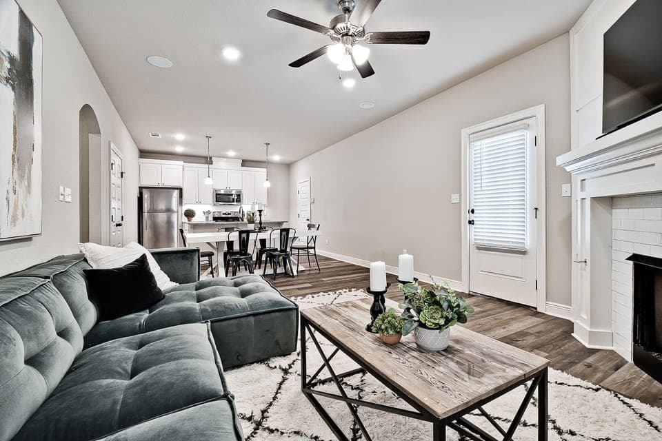 Open living/dining/kitchen area with access to driveway.